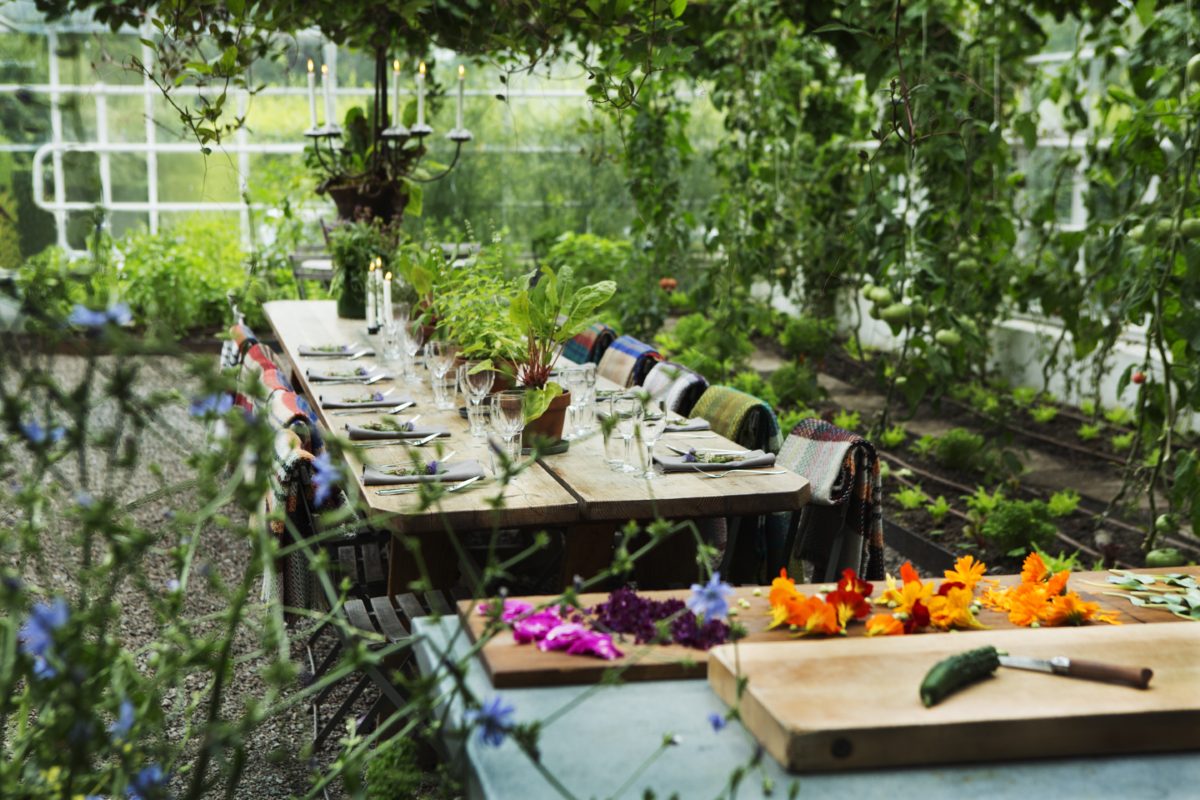 A decorated table in a garden in Sweden.